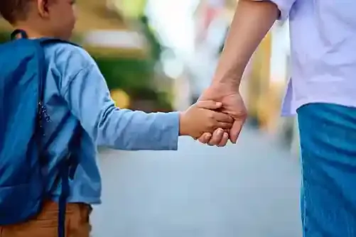 Evaheld child and adult holding hands while they walk featured image for essentials-legal-executor-checklist-plan